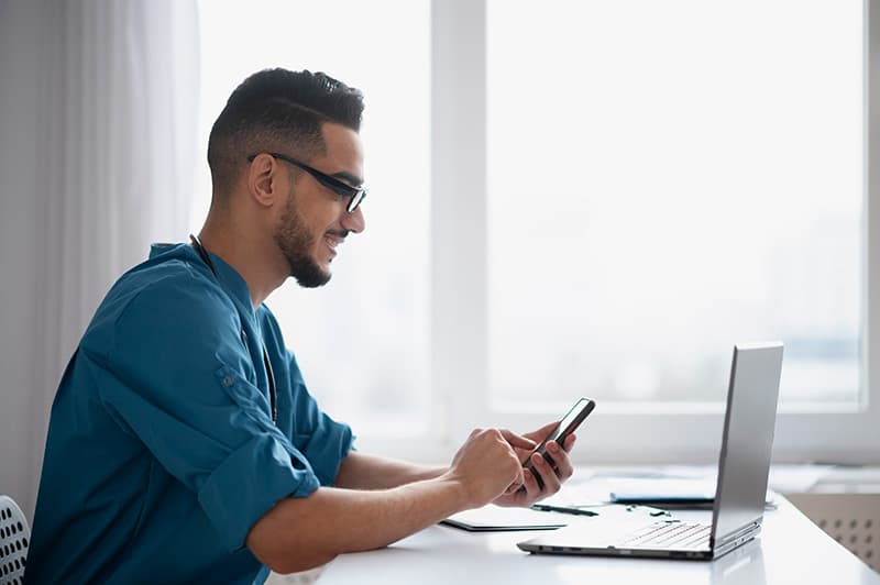 Person completing a finance application on a laptop