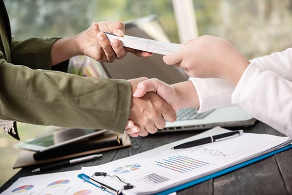 Person reviewing loan options on a laptop